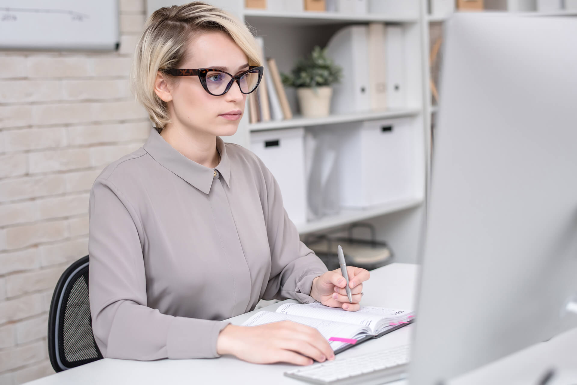 busy-businesswoman-working-in-office-PAESWHB.jpg